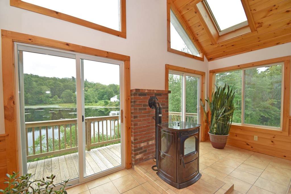 16 Farm Pond Road Oakham, MA 01068 - Photo 9 of 21 a view of a porch with furniture