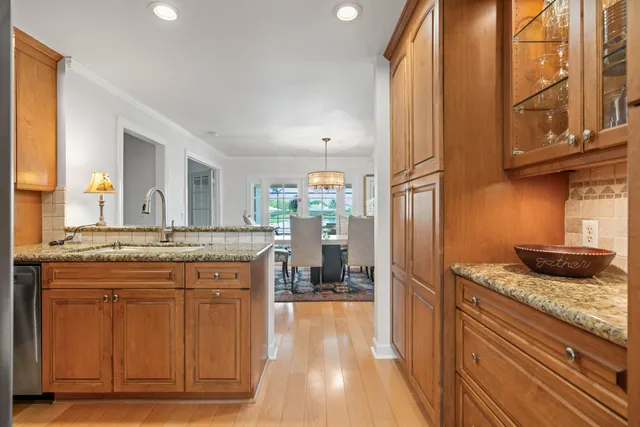 a en suite bathroom with a granite countertop sink mirror and shower