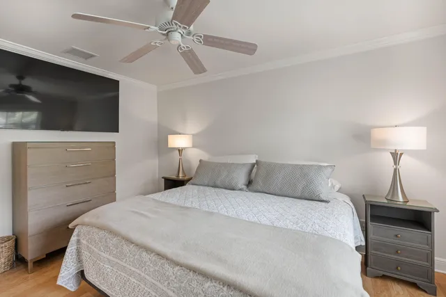 a bathroom with a granite countertop toilet a sink and a mirror