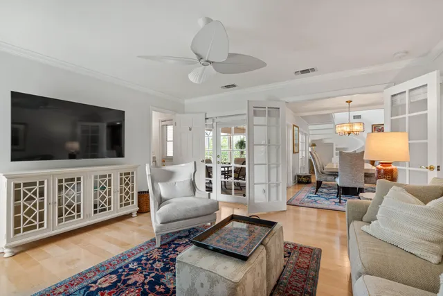 a view of a house with a yard and a lake view