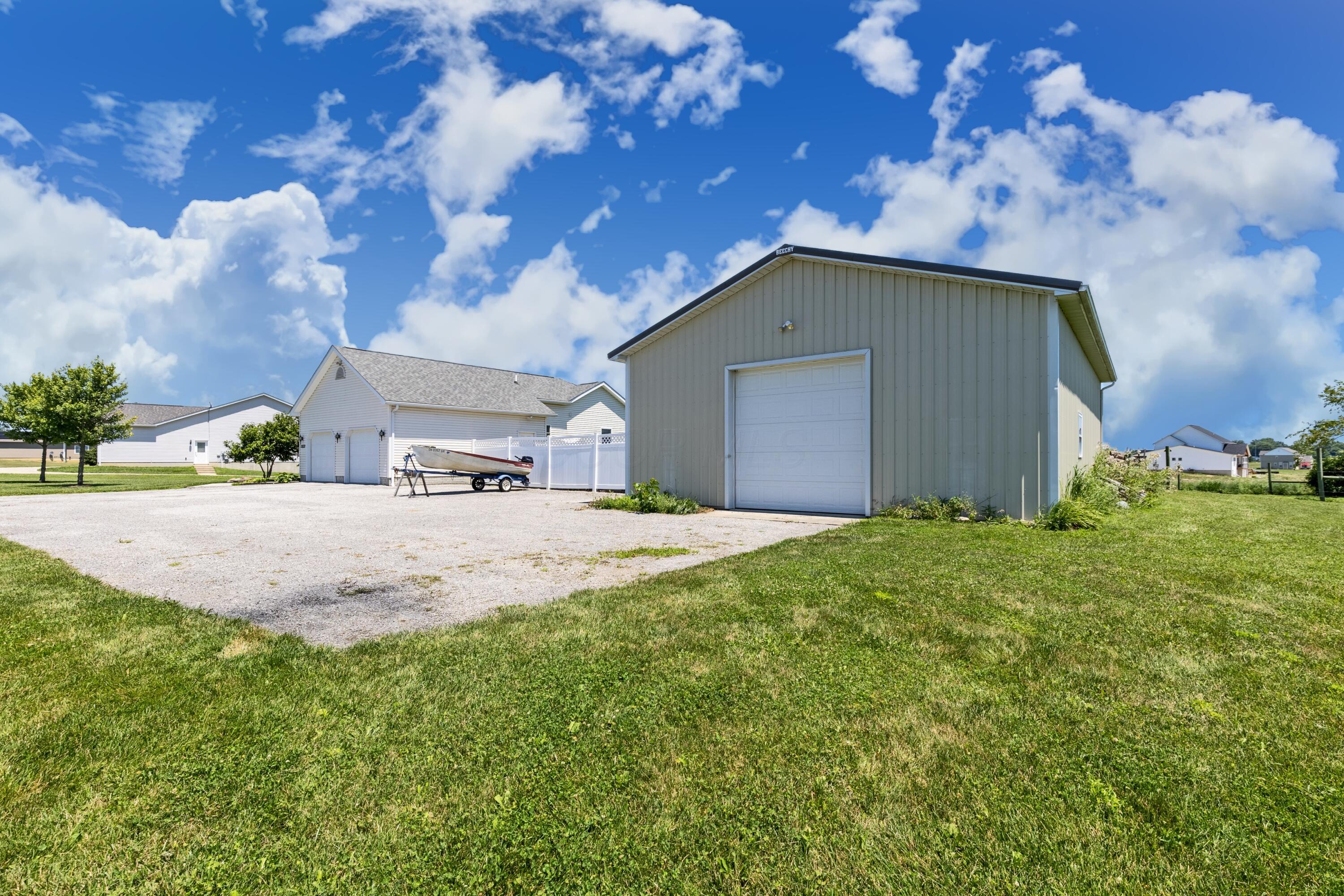 3582 Panhandle Road Delaware, OH 43015 - Photo 47 of 65 • Steel exterior • Concrete floor • Man door • Ceiling light • Liftmaster® electric door opener • Woodburning stove (heated) • Electric panel (separate from house) • Generator is negotiable