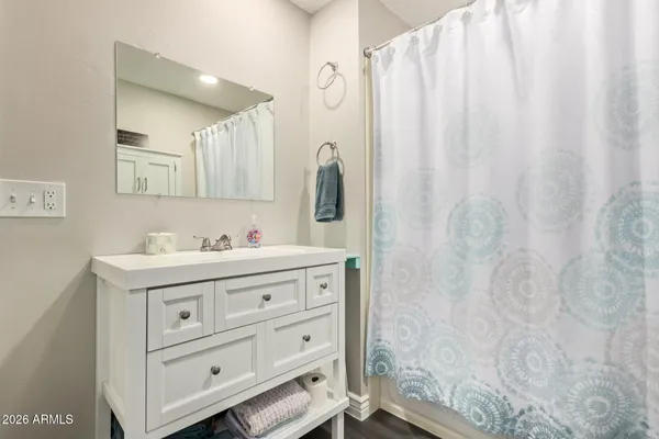 a bathroom with a sink and a mirror