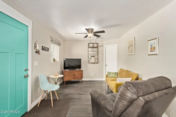 a living room with furniture and a flat screen tv