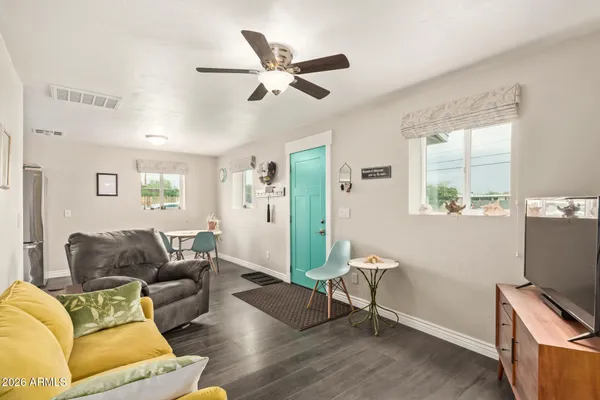 a living room with furniture and a window