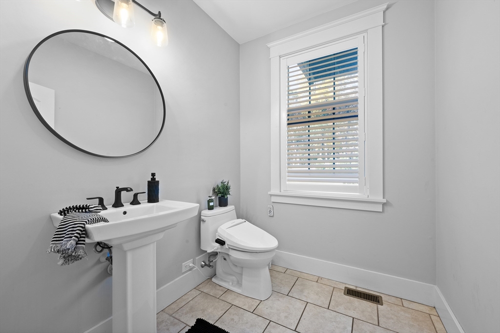 6 Brickyard Road Leicester, MA 01524 - Photo 14 of 41 a bathroom with a sink a toilet and a mirror