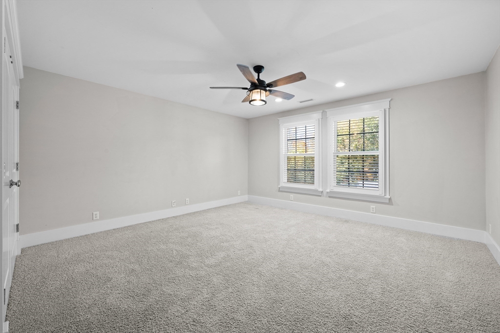 6 Brickyard Road Leicester, MA 01524 - Photo 20 of 41 an empty room with windows and ceiling fan