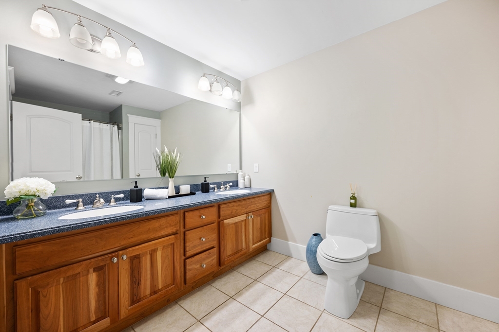 6 Brickyard Road Leicester, MA 01524 - Photo 24 of 41 a bathroom with a toilet sink and mirror