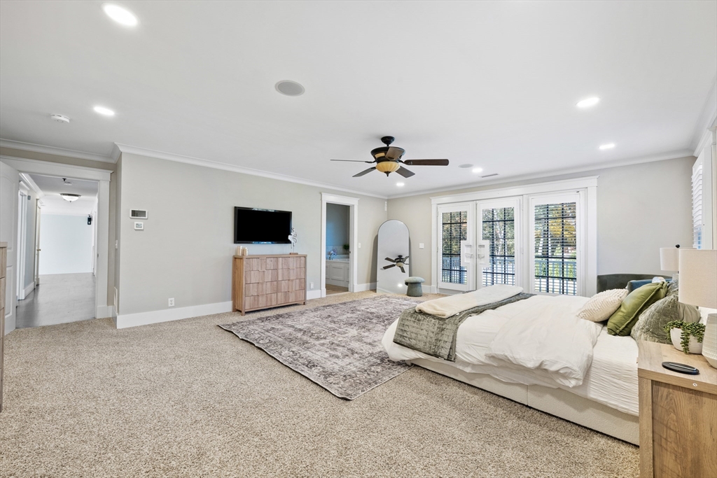 6 Brickyard Road Leicester, MA 01524 - Photo 26 of 41 a spacious bedroom with a bed and a flat screen tv