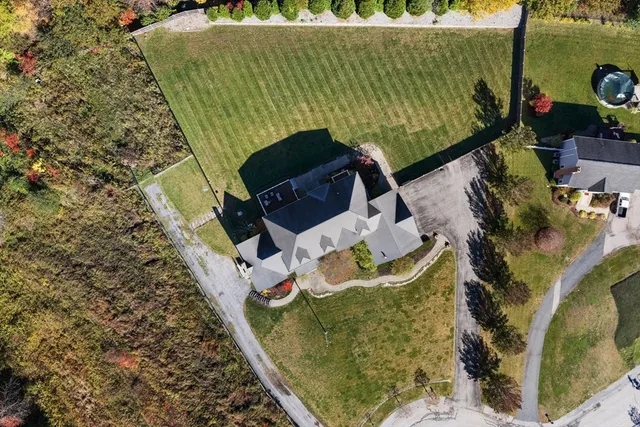 an aerial view of a house with a garden