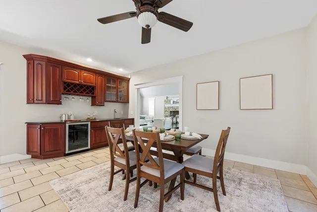 a dining room with furniture and window
