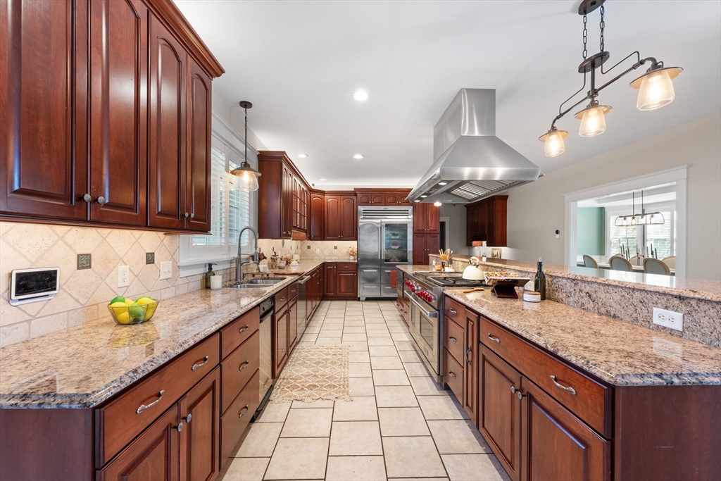 6 Brickyard Road Leicester, MA 01524 - Photo 9 of 41 a large kitchen with granite countertop a sink dishwasher stove and cabinets with wooden floor
