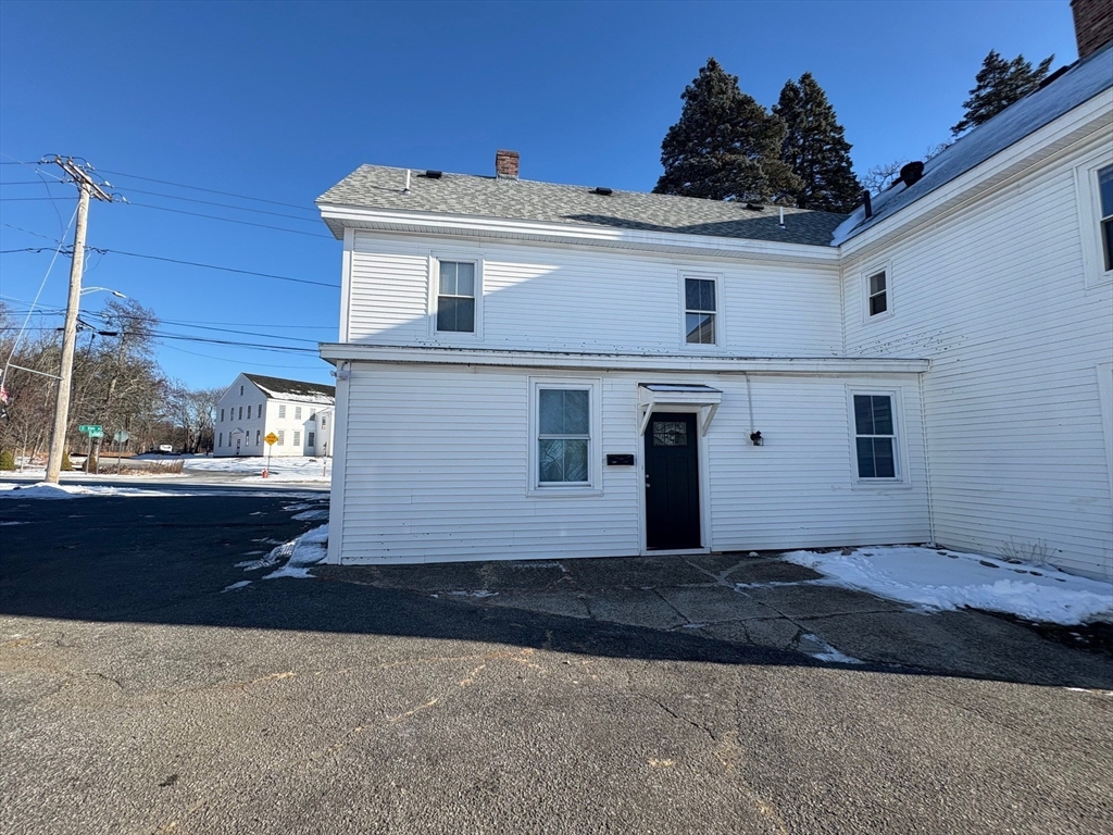 258 Elm Street, Unit REAR Amesbury, MA 01913 - Photo 2 of 12 a view of a house with a yard