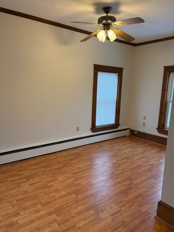 258 Elm Street, Unit REAR Amesbury, MA 01913 - Photo 7 of 12 a view of room with window and wooden floor