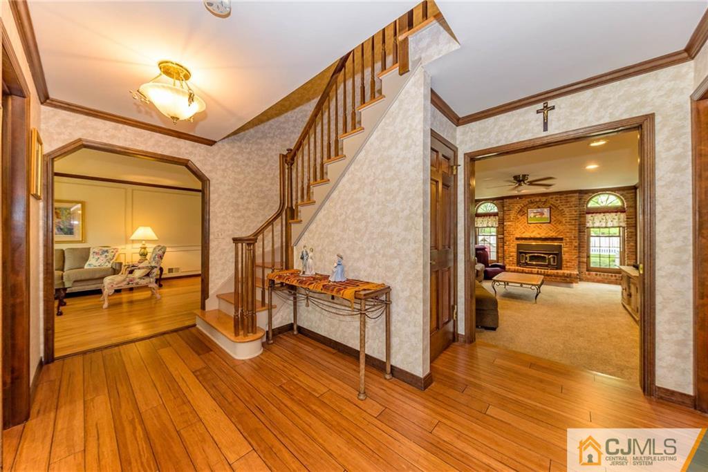 23 Covered Bridge Road Branchburg, NJ 08853 - Photo 2 of 25 a view of a livingroom with wooden floor and furniture