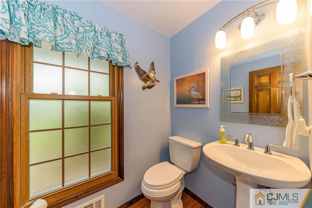 23 Covered Bridge Road Branchburg, NJ 08853 - Photo 12 of 25 a bathroom with a sink toilet and mirror