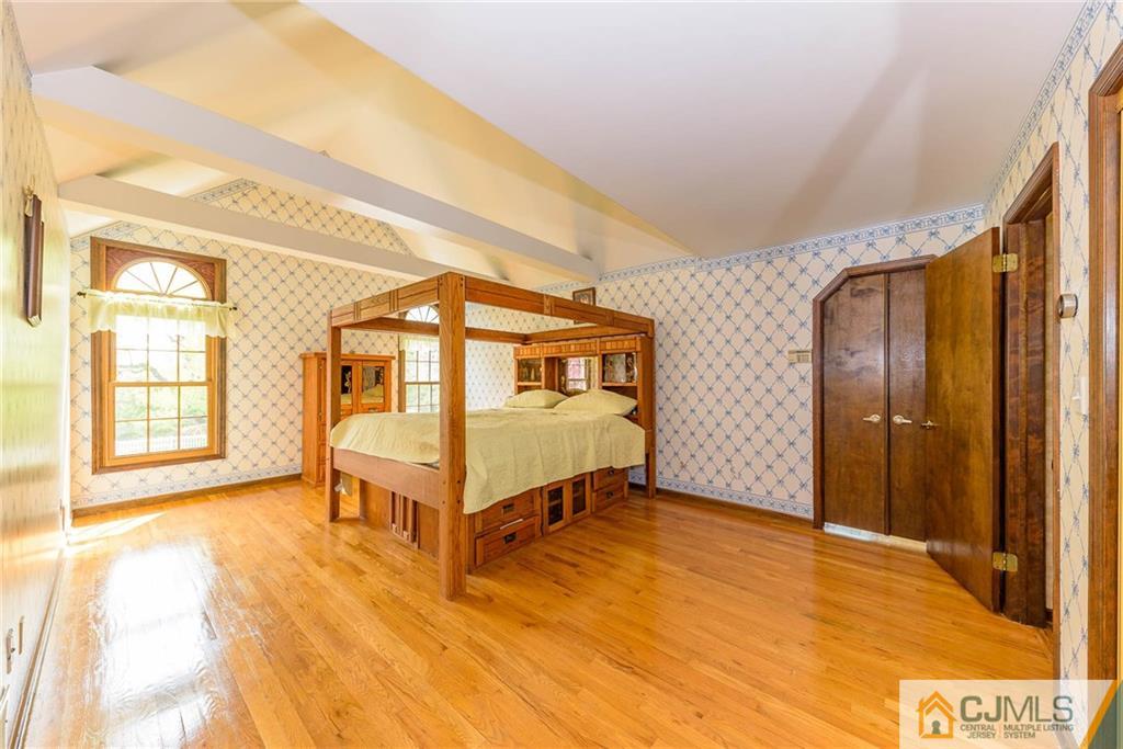 23 Covered Bridge Road Branchburg, NJ 08853 - Photo 13 of 25 a spacious bedroom with a bed and a large window