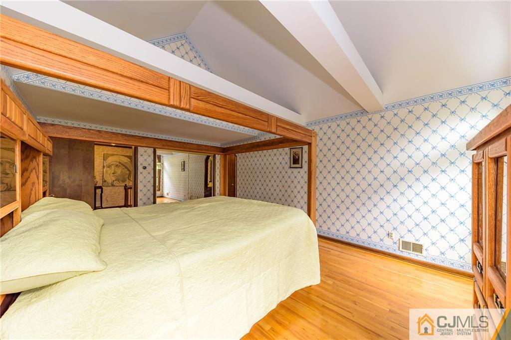 23 Covered Bridge Road Branchburg, NJ 08853 - Photo 14 of 25 a large bed sitting in a bedroom next to a window