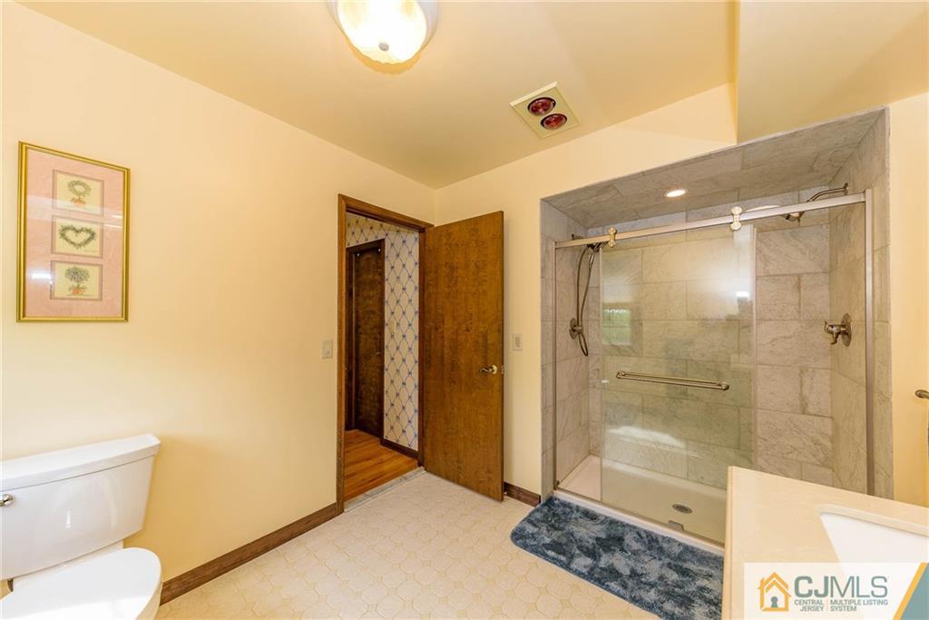 23 Covered Bridge Road Branchburg, NJ 08853 - Photo 16 of 25 a bathroom with a shower and a toilet