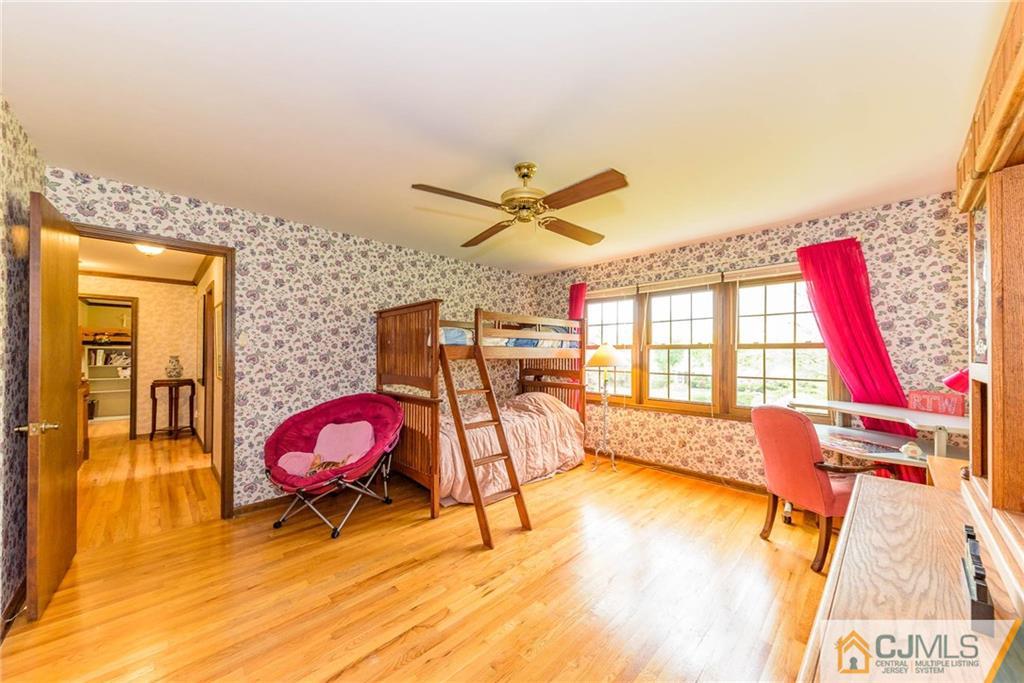 23 Covered Bridge Road Branchburg, NJ 08853 - Photo 17 of 25 a living room with furniture a rug and a floor to ceiling window