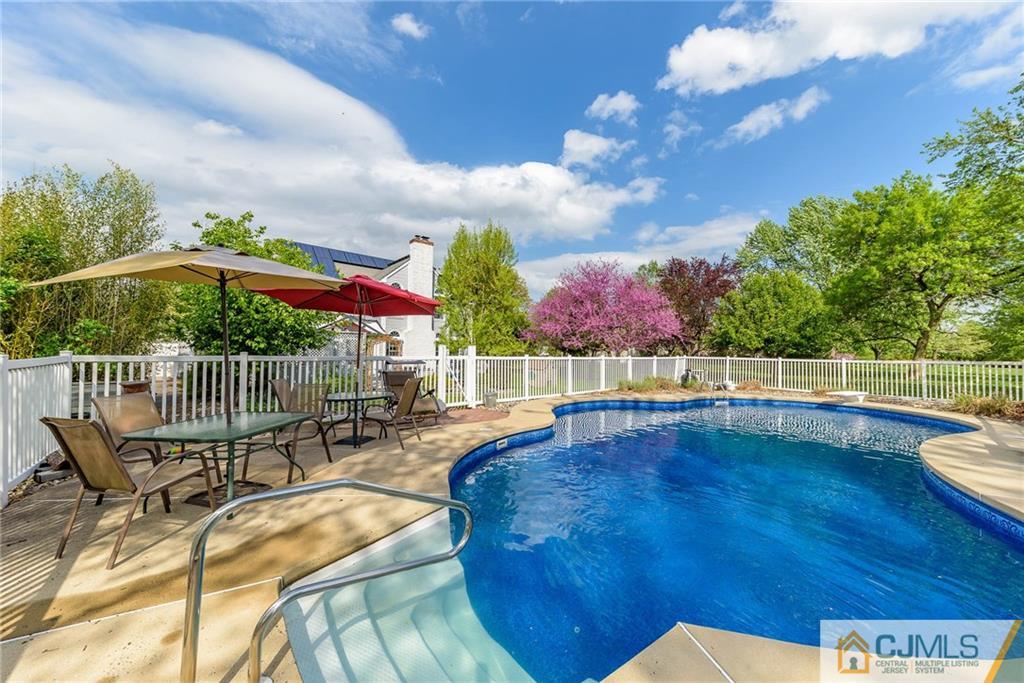 23 Covered Bridge Road Branchburg, NJ 08853 - Photo 22 of 25 a view of a swimming pool with a patio
