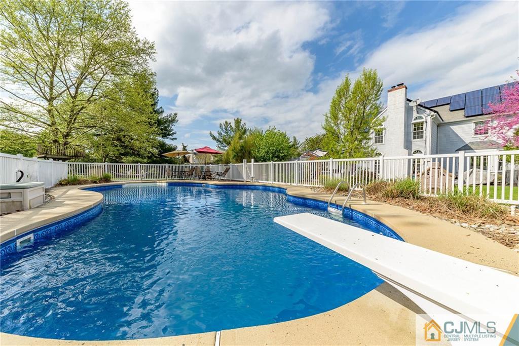 23 Covered Bridge Road Branchburg, NJ 08853 - Photo 23 of 25 a view of a swimming pool with a patio