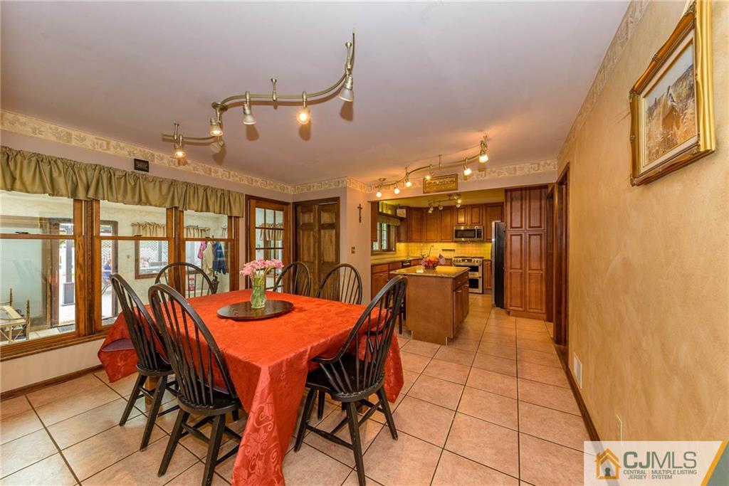 23 Covered Bridge Road Branchburg, NJ 08853 - Photo 5 of 25 a dining room with furniture and a large window