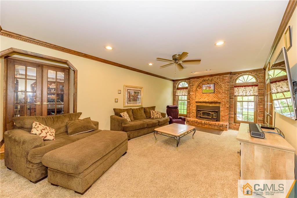 23 Covered Bridge Road Branchburg, NJ 08853 - Photo 10 of 25 a living room with furniture and a large window
