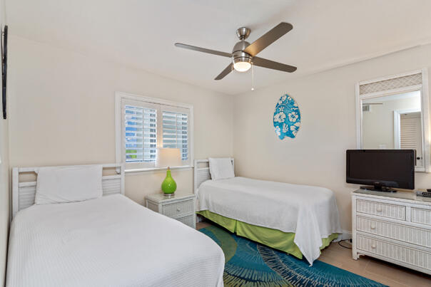 4100 East County Highway 30A, Unit 708 Santa Rosa Beach, FL 32459 - Photo 6 of 6 a bedroom with a bed a window and a flat screen tv