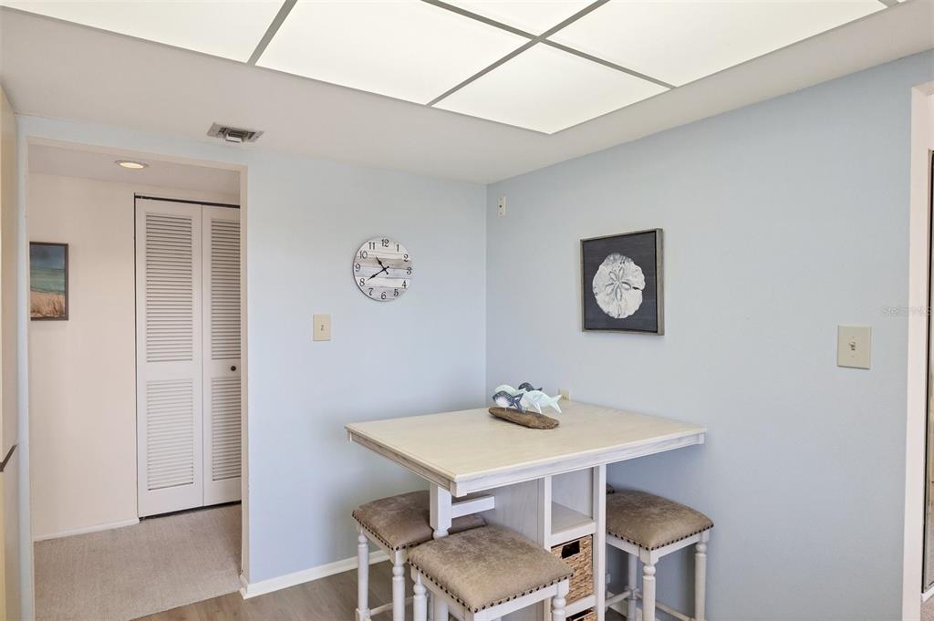 6285 Midnight Pass Road, Unit 403 Sarasota, FL 34242 - Photo 14 of 53 a view of a dining room with furniture