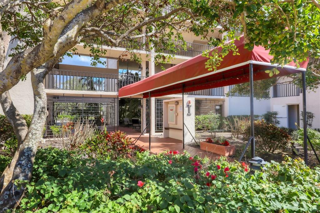 6285 Midnight Pass Road, Unit 403 Sarasota, FL 34242 - Photo 2 of 53 front view of a house with a porch