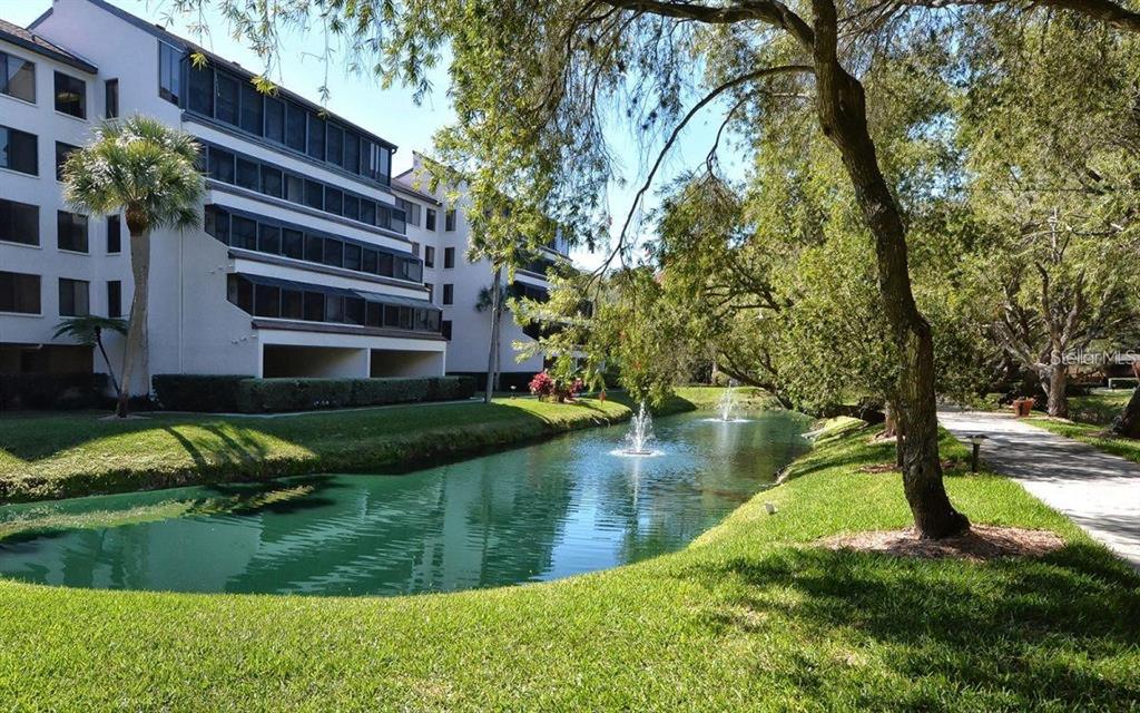 6285 Midnight Pass Road, Unit 403 Sarasota, FL 34242 - Photo 34 of 53 a view of a lake with a building in the background