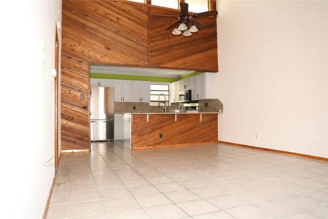 a view of a kitchen with a sink and cabinets