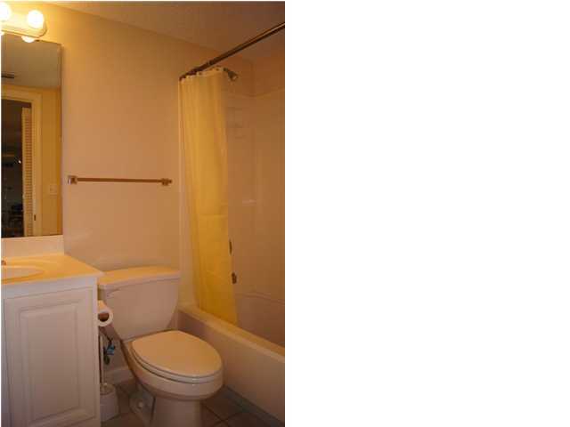 970 Highway 98, Unit 202 Destin, FL 32541 - Photo 18 of 26 a bathroom with a toilet and a shower