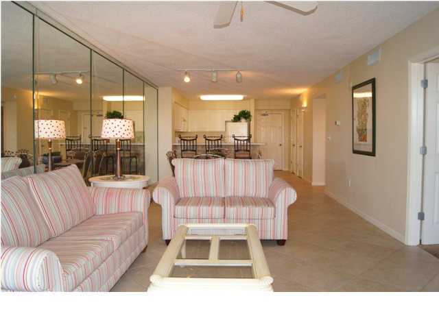 970 Highway 98, Unit 202 Destin, FL 32541 - Photo 21 of 26 a living room with a couch and a view of dining room