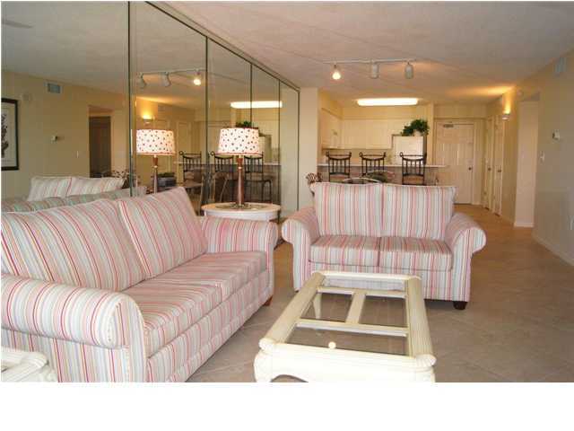970 Highway 98, Unit 202 Destin, FL 32541 - Photo 22 of 26 a living room with a couch and a view of kitchen