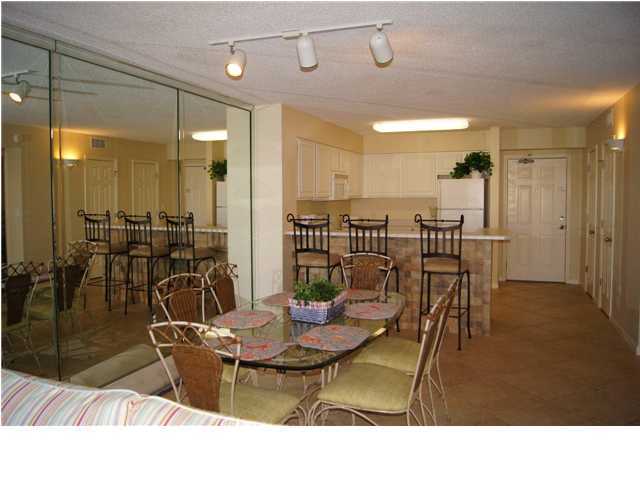 970 Highway 98, Unit 202 Destin, FL 32541 - Photo 4 of 26 a view of a dining room with furniture