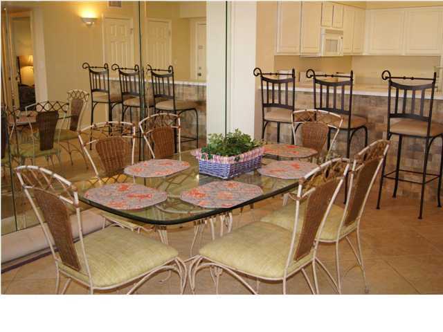 970 Highway 98, Unit 202 Destin, FL 32541 - Photo 5 of 26 a dining room with furniture and wooden floor