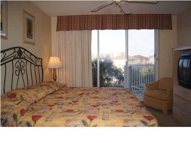 970 Highway 98, Unit 202 Destin, FL 32541 - Photo 10 of 26 a bedroom with a bed and a window