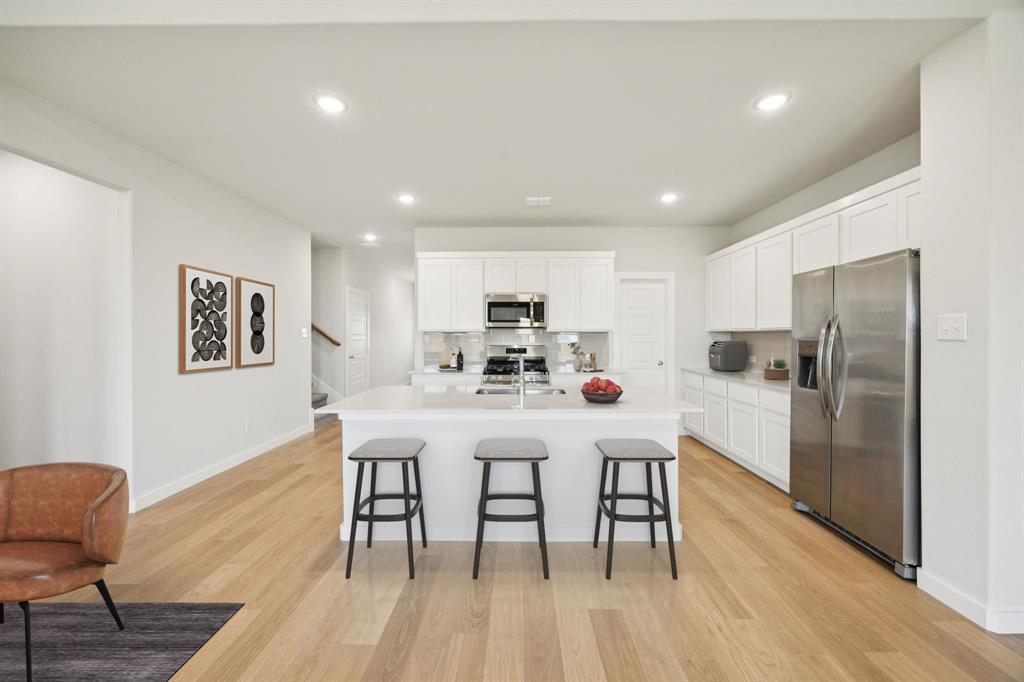 2313 Wind River Road Princeton, TX 75407 - Photo 7 of 35 Kitchen in the Masters home plan by Trophy Signature Homes – REPRESENTATIVE PHOTO