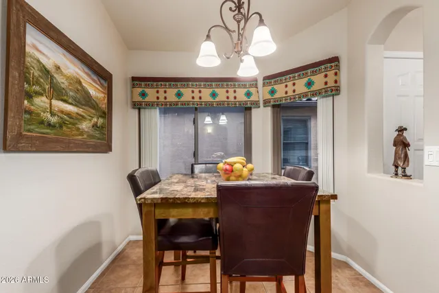a dining room with furniture and window