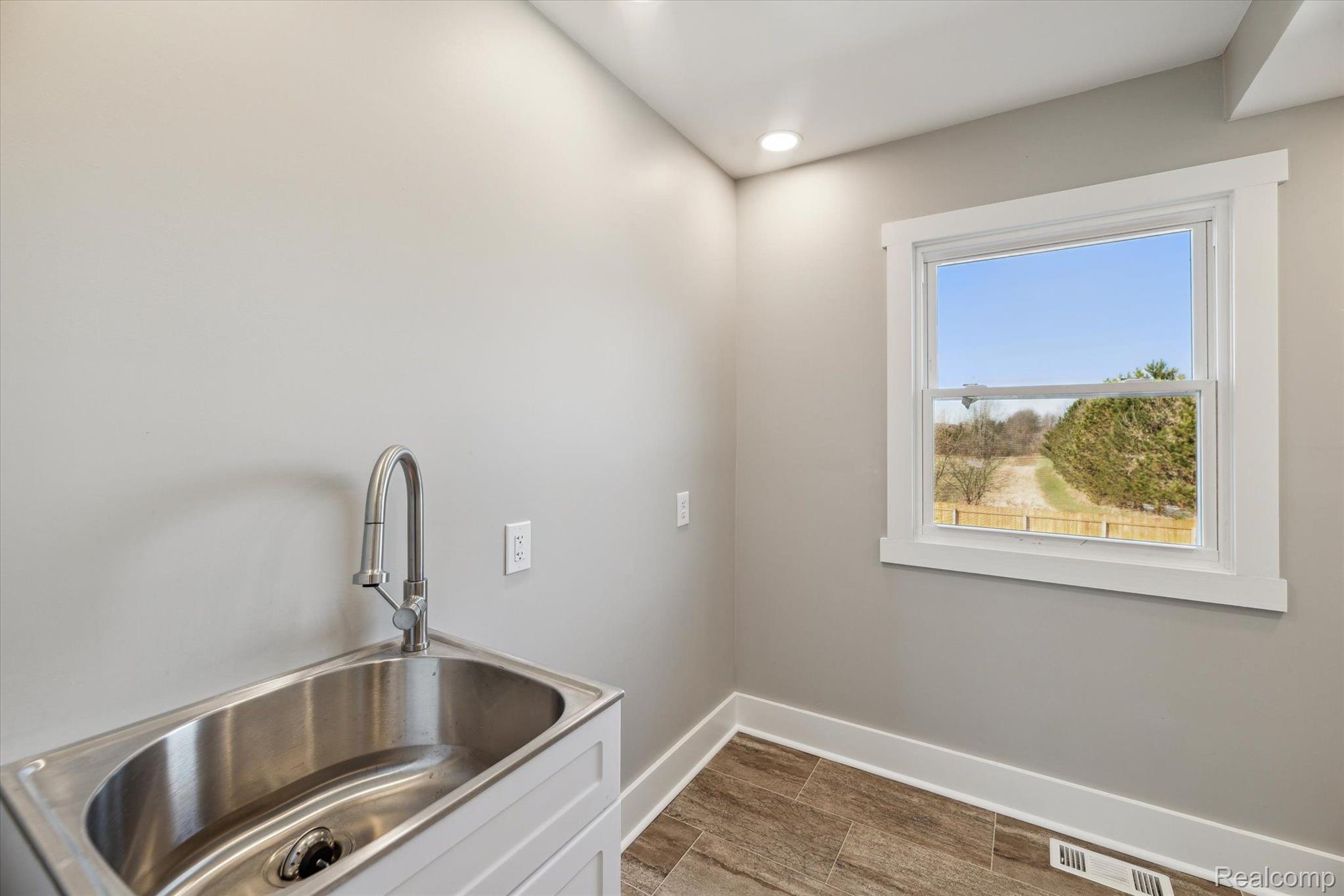 18350 Hickory Ridge Road Fenton, MI 48430 - Photo 20 of 30 Add your own custom counter next to utility sink