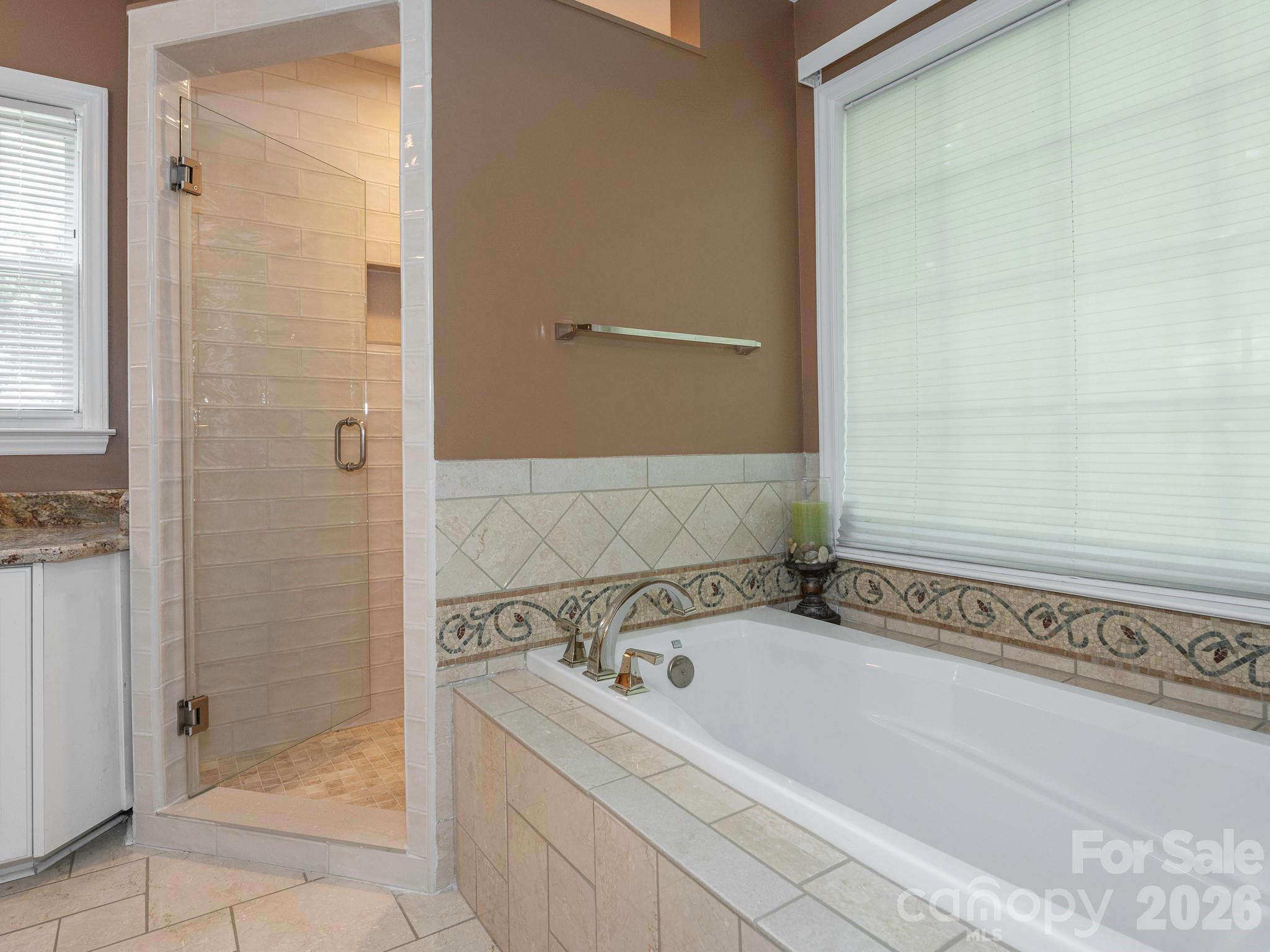 4440 Hucks Road Charlotte, NC 28269 - Photo 24 of 45 a bathroom with a bathtub and shower