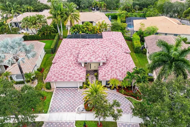 an aerial view of a house with a garden and plants