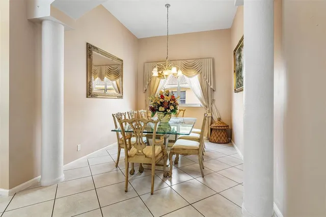 a dining room with furniture and window