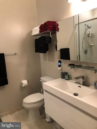 a bathroom with a shower and a mirror
