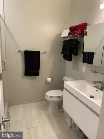 a bathroom with a shower and a sink
