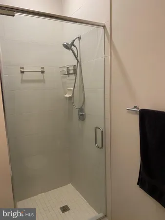 a en suite bathroom with a sink and a mirror