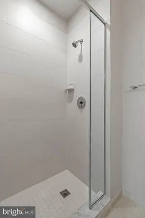 a kitchen with refrigerator cabinets and a ceiling fan