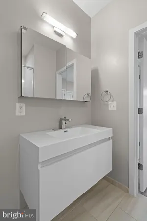 a kitchen with stainless steel appliances a sink stove and refrigerator