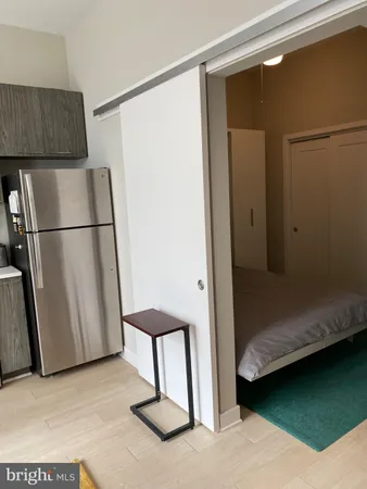 a kitchen with a sink stainless steel appliances and cabinets